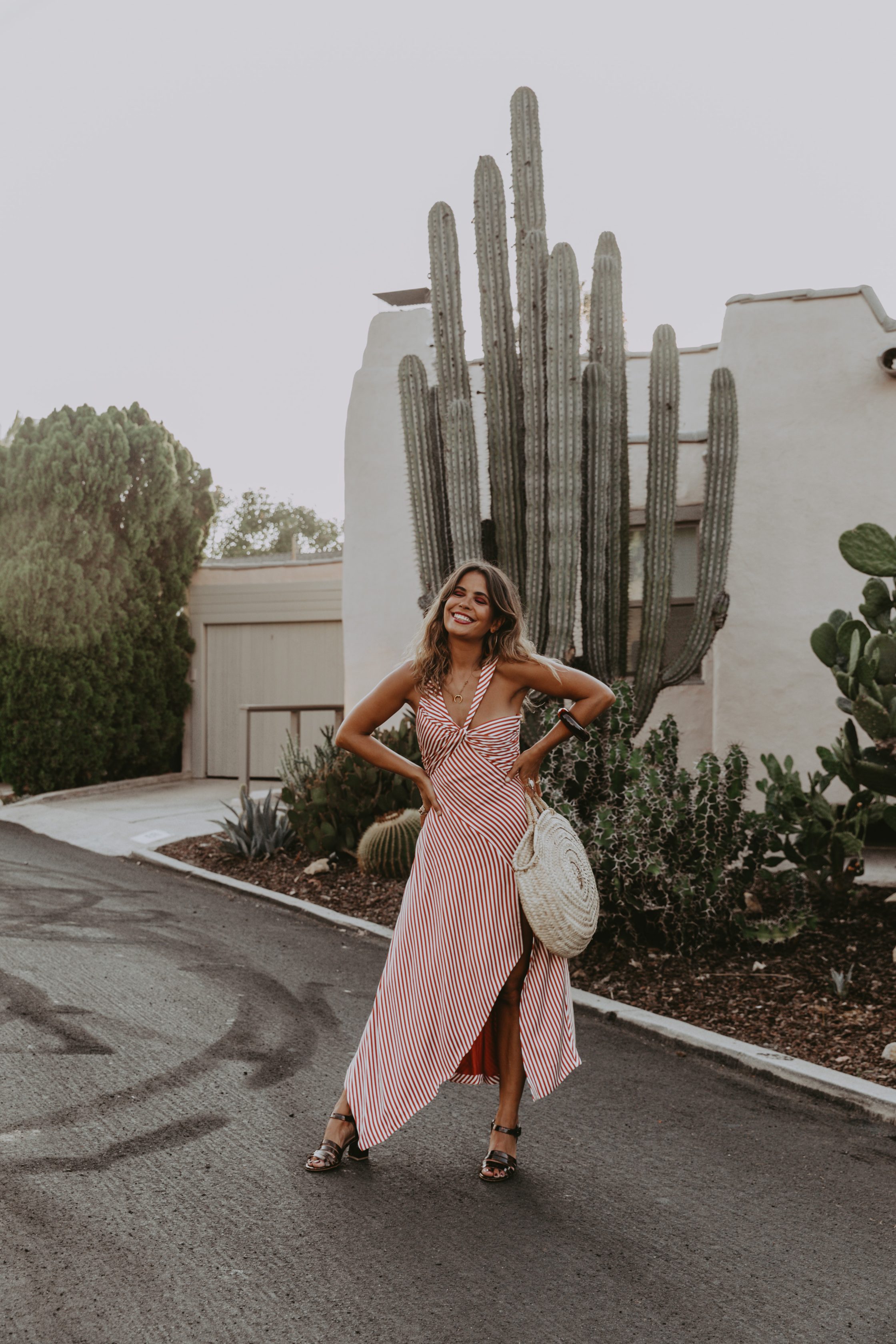 Sara Escudero for Collage Vintage is wearing a Jonathan Simkhai striped dress and Maryam Nassir Zadeh sandals