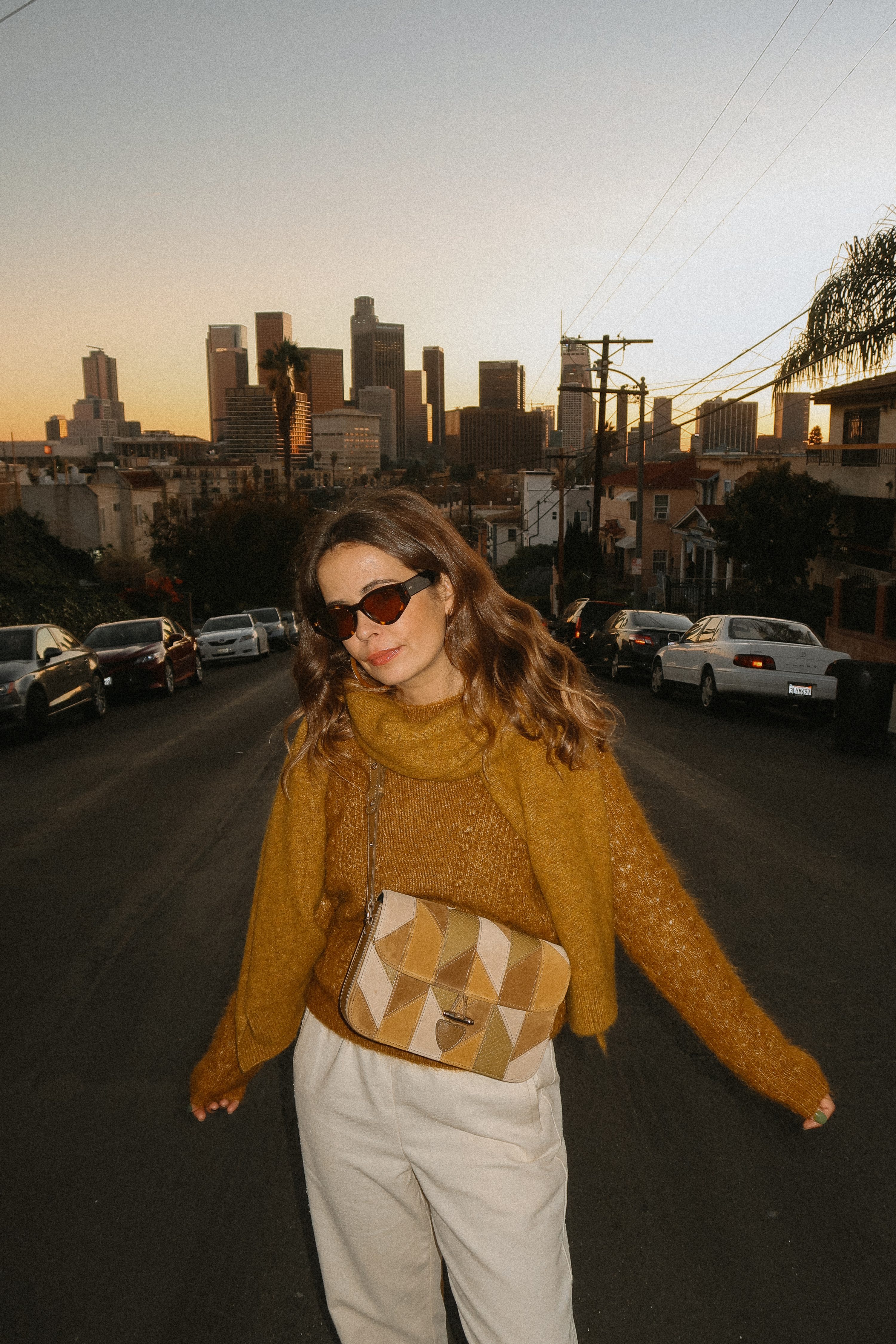 Collage Vintage wearing a Sézane outfit. Knit gold jumper, white pants, patchwork bag and Chanel shoes